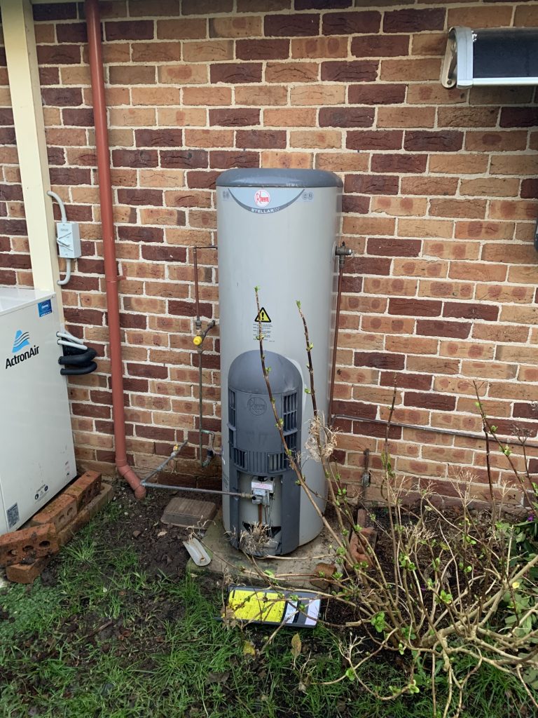 hot water system installed outside of a house