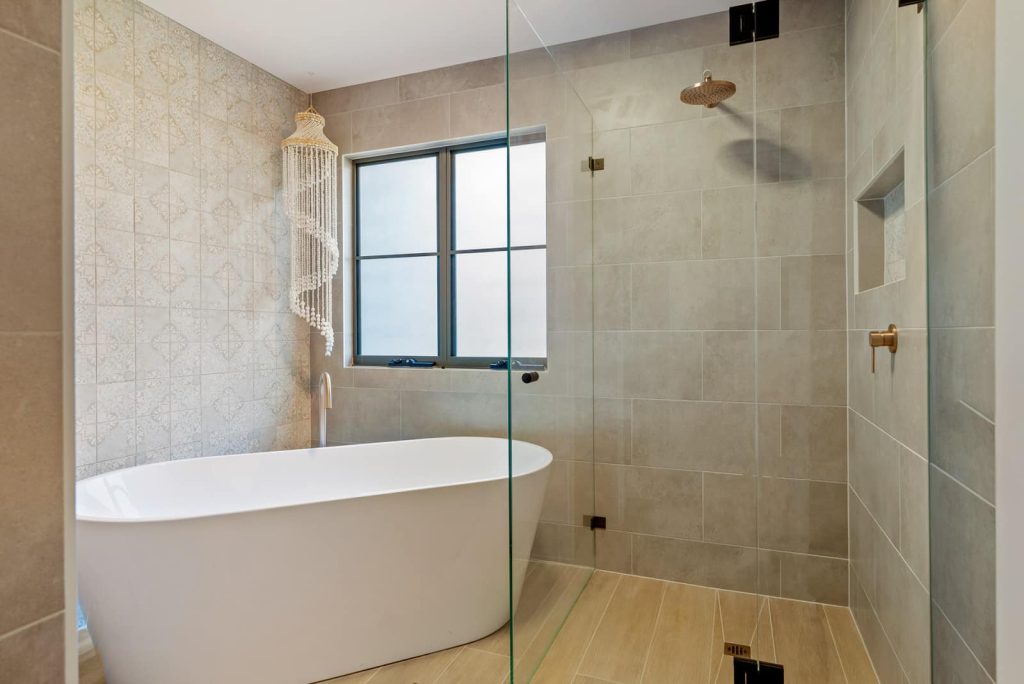 Fully renovated bathroom with bathtub and shower